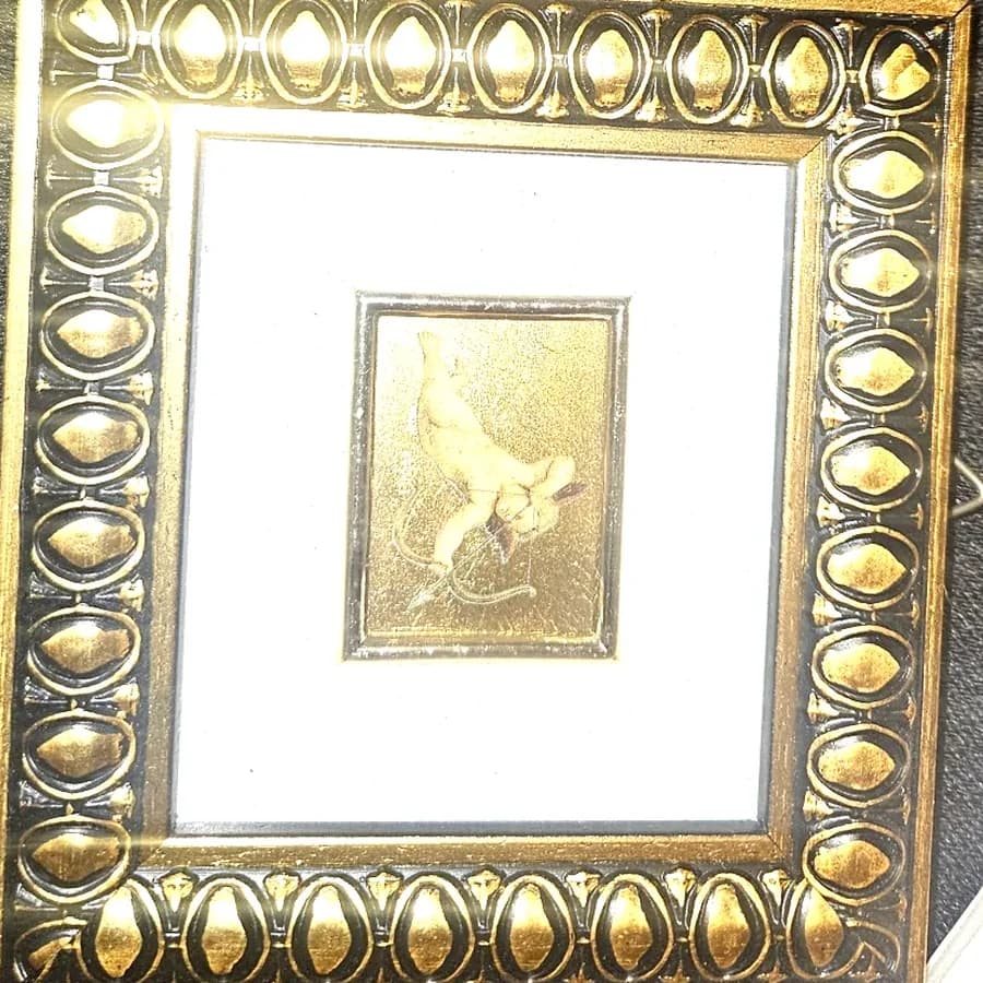 A gilt framed gold relief miniature
